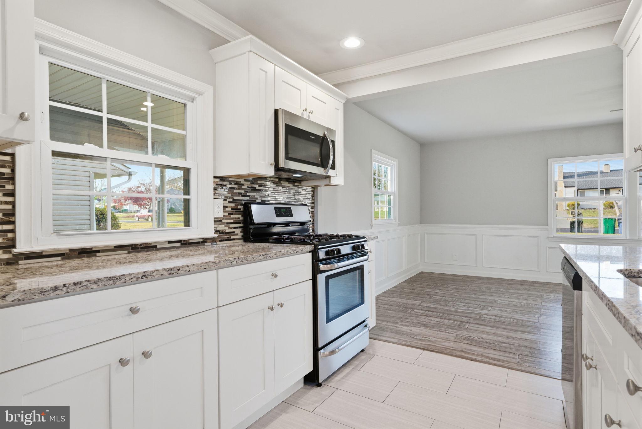 208 Trenton Road Fairless Hills, PA 19030 - Photo 14 of 35 a kitchen with stainless steel appliances granite countertop a stove and a sink