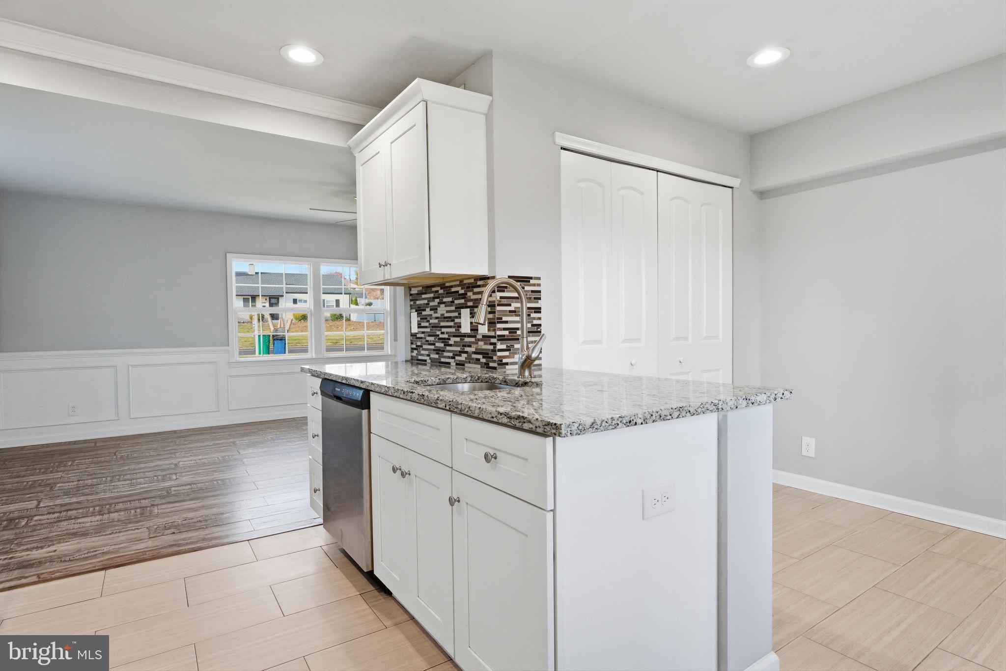 208 Trenton Road Fairless Hills, PA 19030 - Photo 15 of 35 a kitchen with granite countertop a sink and a stove