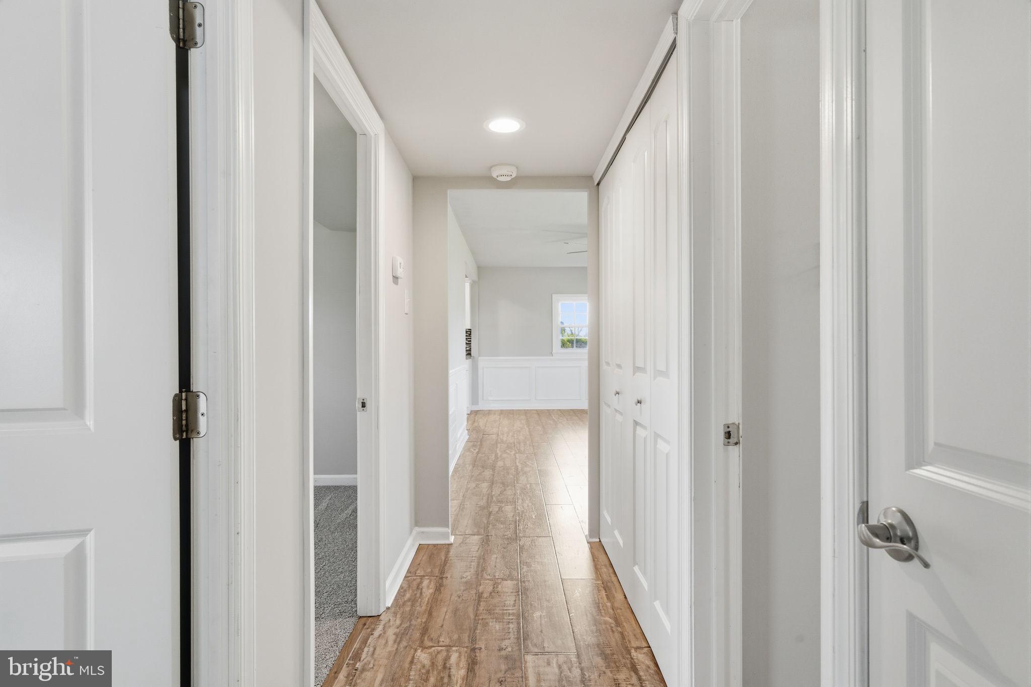 208 Trenton Road Fairless Hills, PA 19030 - Photo 20 of 35 a view of a hallway with wooden floor and staircase