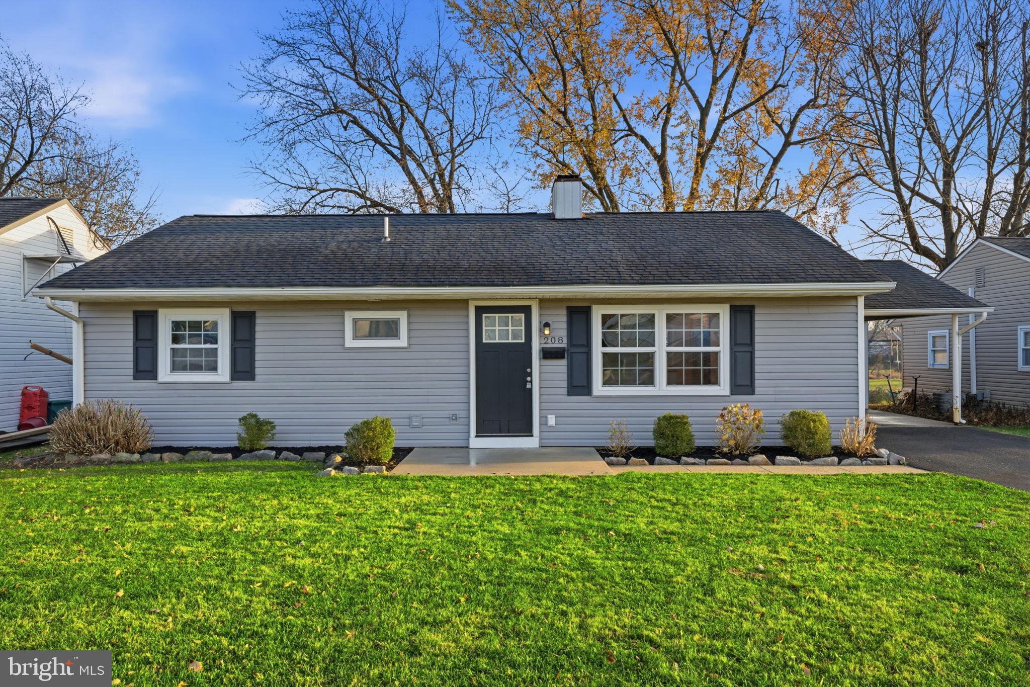 208 Trenton Road Fairless Hills, PA 19030 - Photo 2 of 35 a front view of a house with a garden and porch