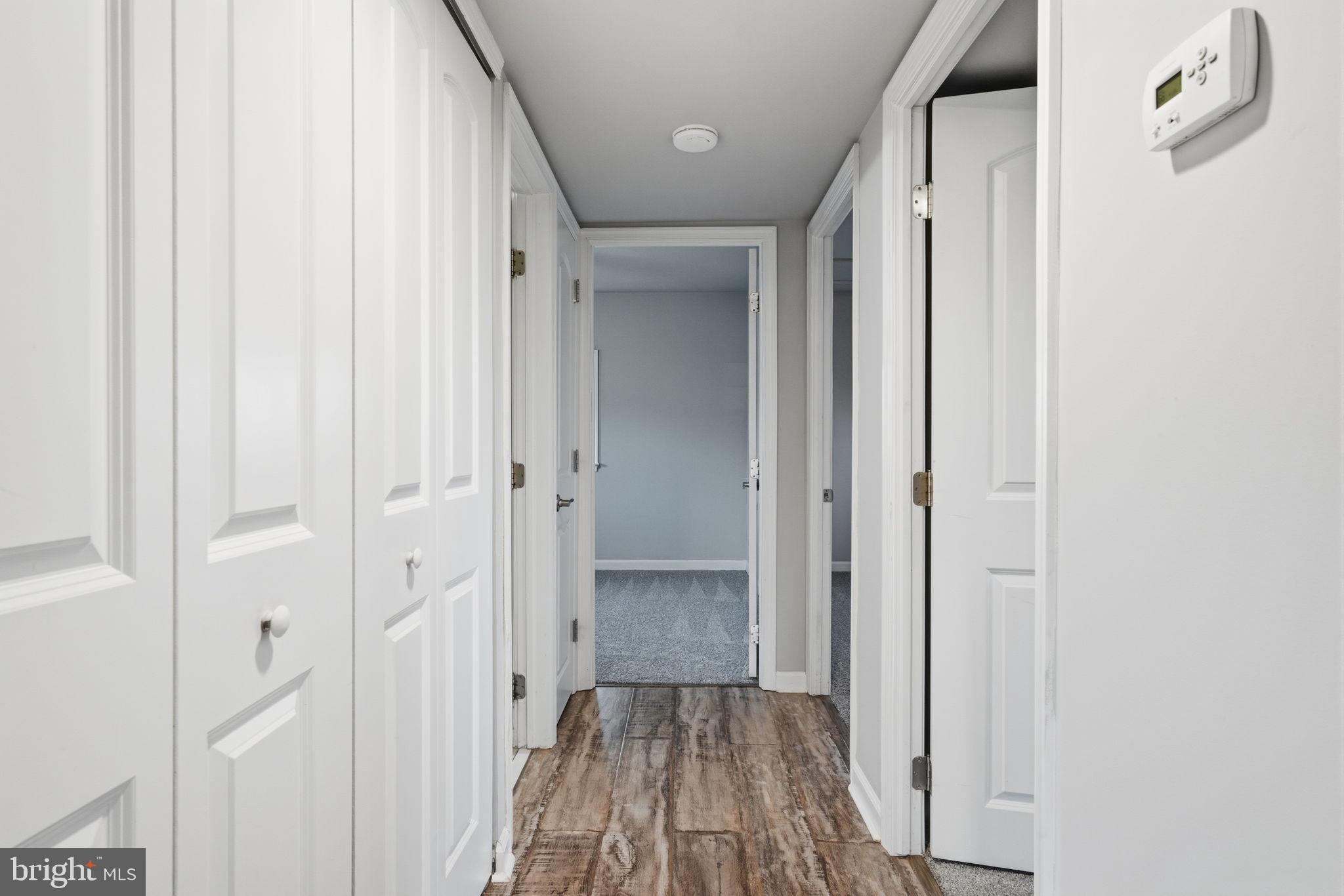 208 Trenton Road Fairless Hills, PA 19030 - Photo 21 of 35 a view of a hallway with wooden floor and closet area