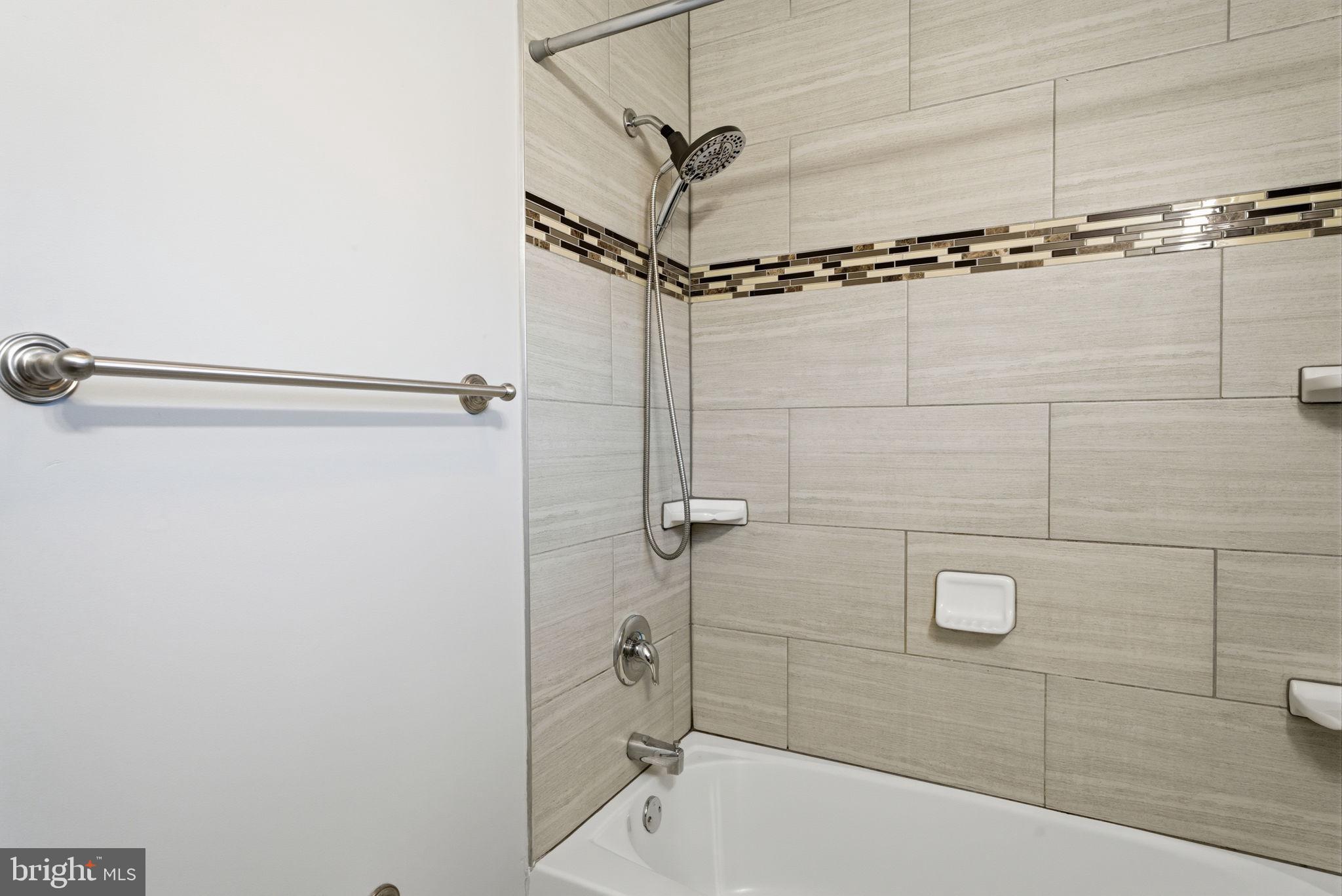 208 Trenton Road Fairless Hills, PA 19030 - Photo 23 of 35 a bathroom with a shower and a bathtub