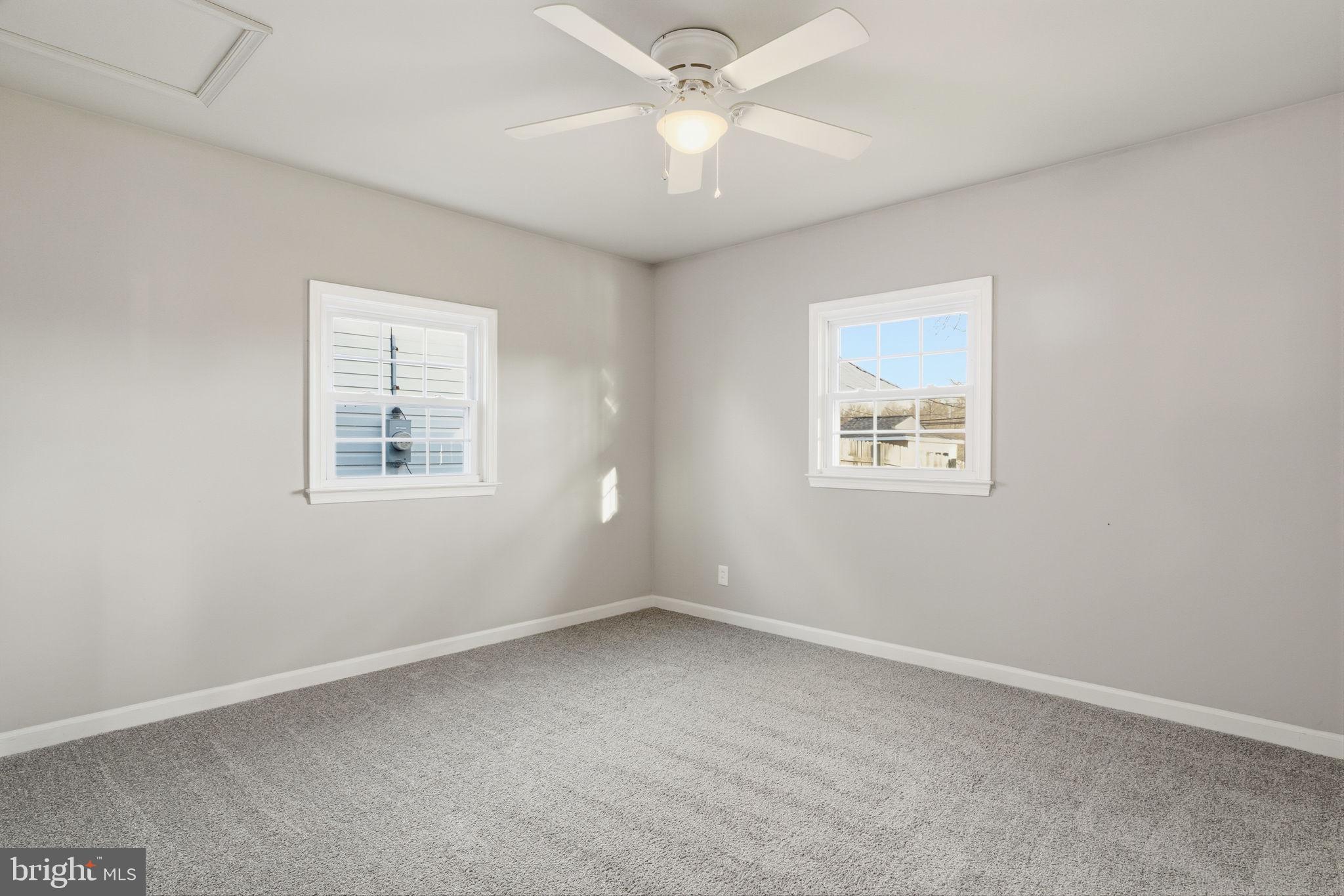 208 Trenton Road Fairless Hills, PA 19030 - Photo 25 of 35 an empty room with a window and ceiling fan