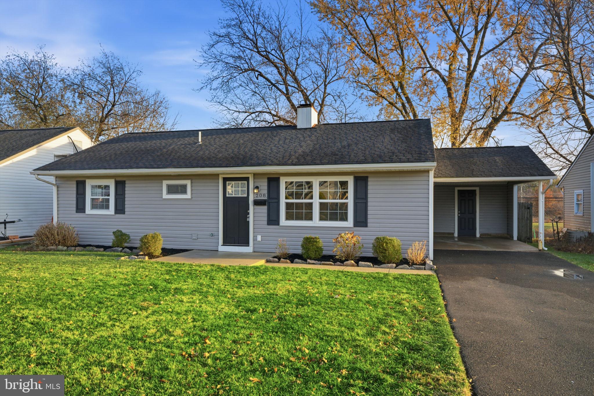 208 Trenton Road Fairless Hills, PA 19030 - Photo 3 of 35 front view of a house with a yard