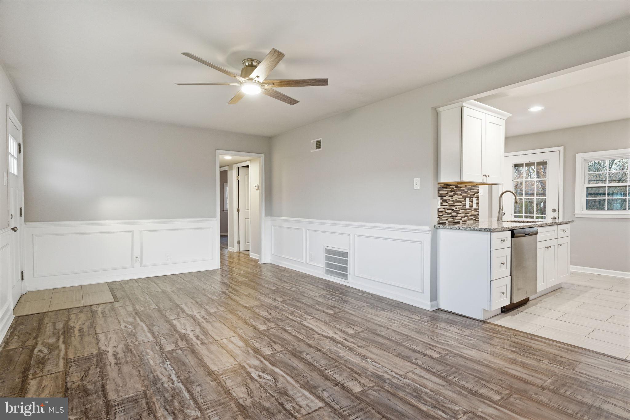 208 Trenton Road Fairless Hills, PA 19030 - Photo 7 of 35 a view of a kitchen with wooden floor and electronic appliances