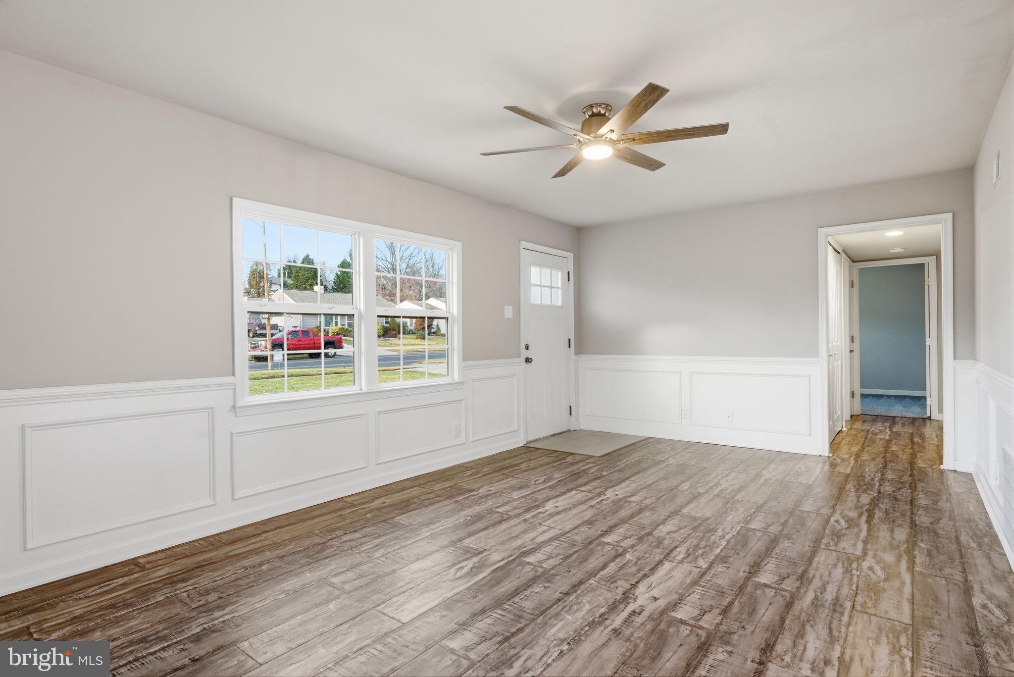 208 Trenton Road Fairless Hills, PA 19030 - Photo 10 of 35 wooden floor in an empty room with a window