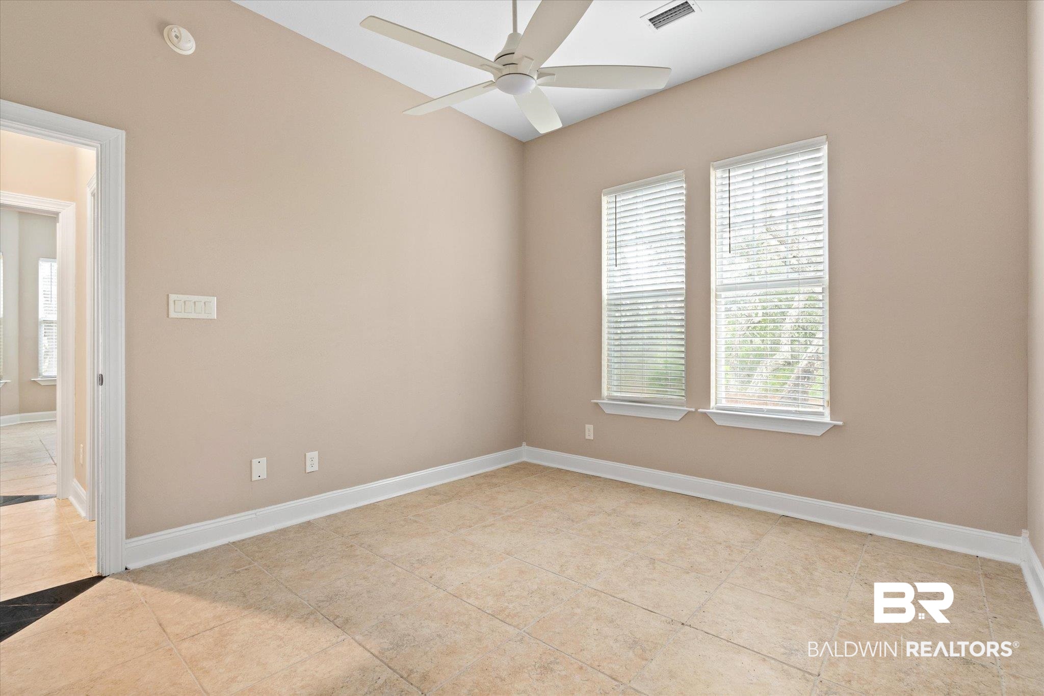9259 Genipa Way Gulf Shores, AL 36542 - Photo 35 of 72 Tiled spare room with ceiling fan