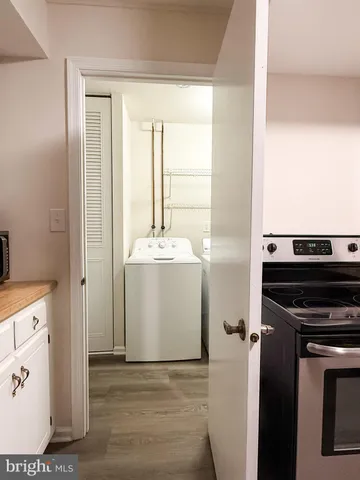 a view of a kitchen with a sink and dishwasher