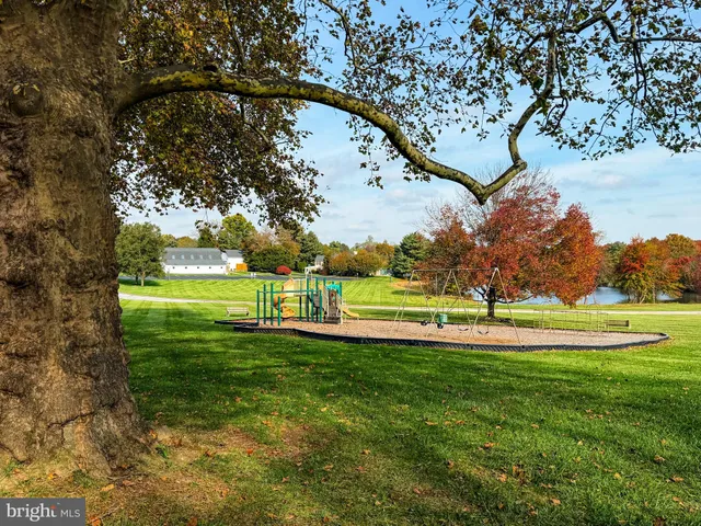 a view of a golf course with a lake view
