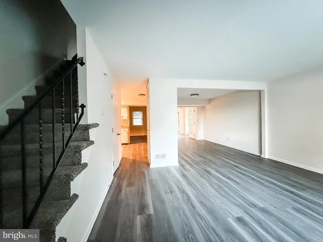 a view of entryway with wooden floor