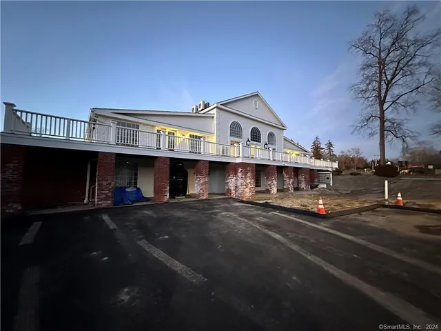 a view of a white building from a balcony
