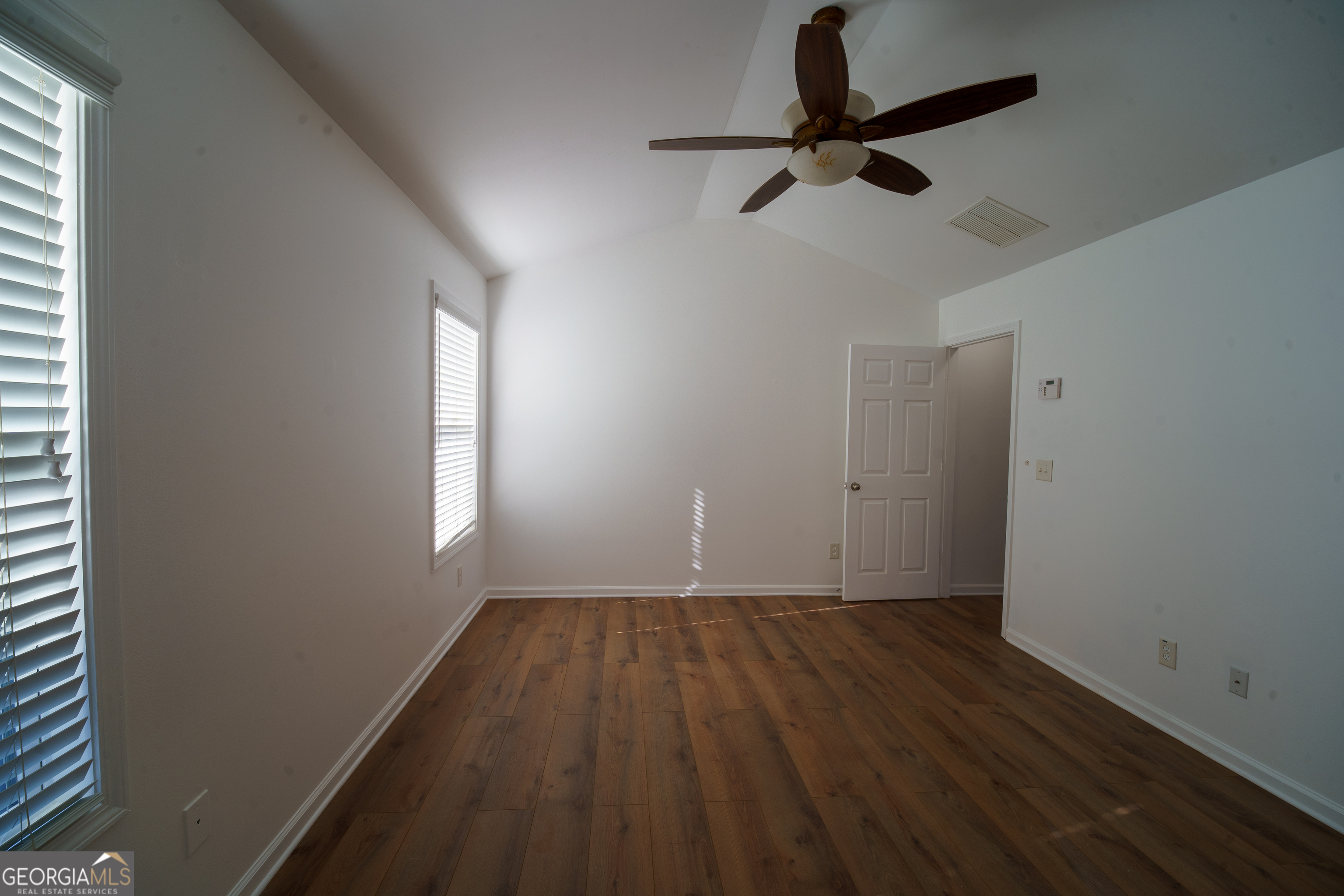 2555 Flat Shoals Road, Unit 1402 South Fulton, GA 30349 - Photo 12 of 18 a view of room with a ceiling fan and window