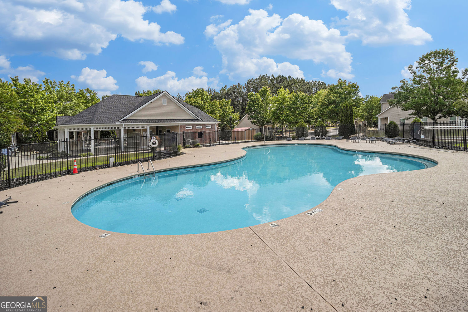 2555 Flat Shoals Road, Unit 1402 South Fulton, GA 30349 - Photo 16 of 18 front view of house with swimming pool and trees in the background