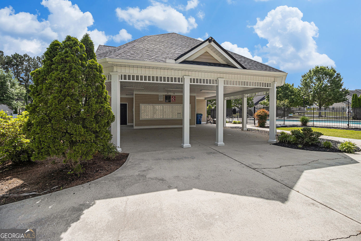 2555 Flat Shoals Road, Unit 1402 South Fulton, GA 30349 - Photo 17 of 18 front view of a house with a garden