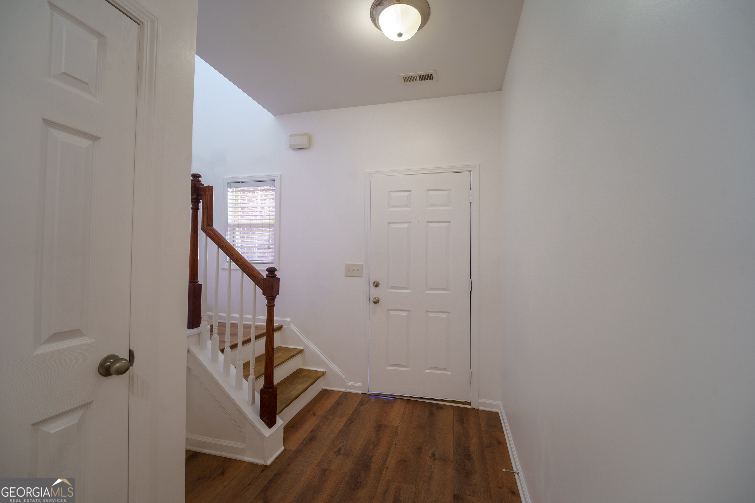 2555 Flat Shoals Road, Unit 1402 South Fulton, GA 30349 - Photo 2 of 18 a view of entryway with wooden floor