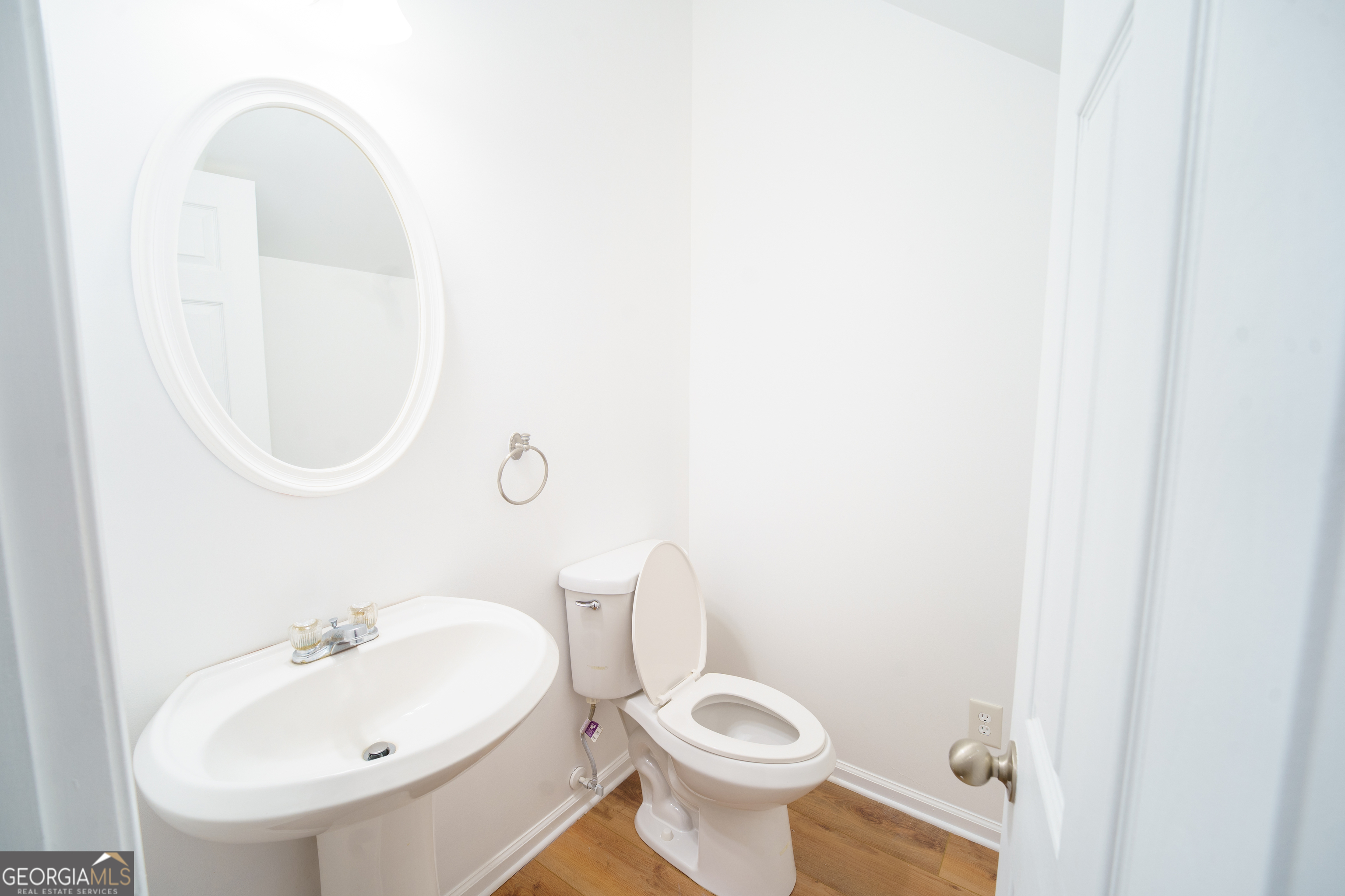 2555 Flat Shoals Road, Unit 1402 South Fulton, GA 30349 - Photo 3 of 18 a bathroom with a sink and a mirror
