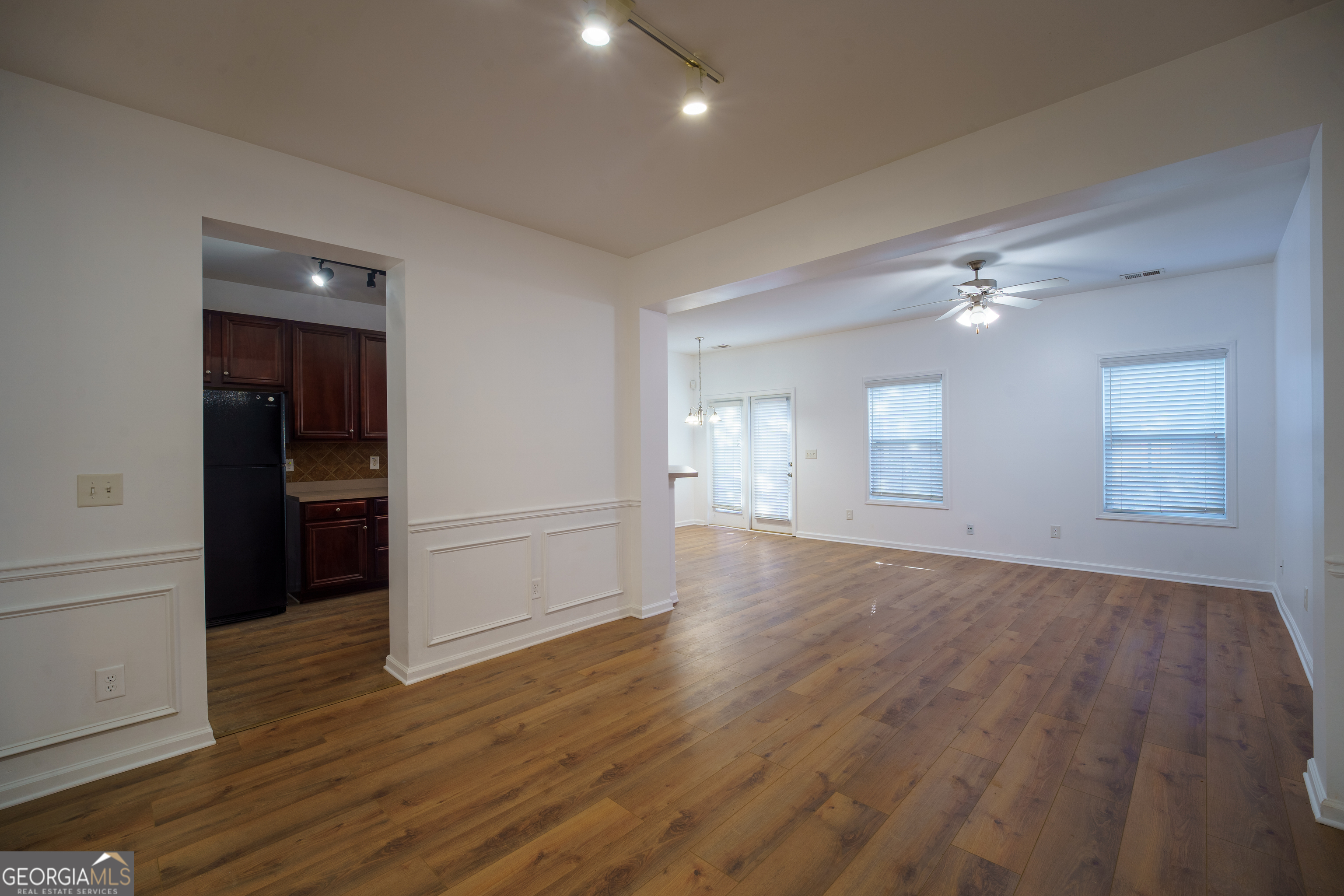 2555 Flat Shoals Road, Unit 1402 South Fulton, GA 30349 - Photo 4 of 18 wooden floor in an empty room with a window