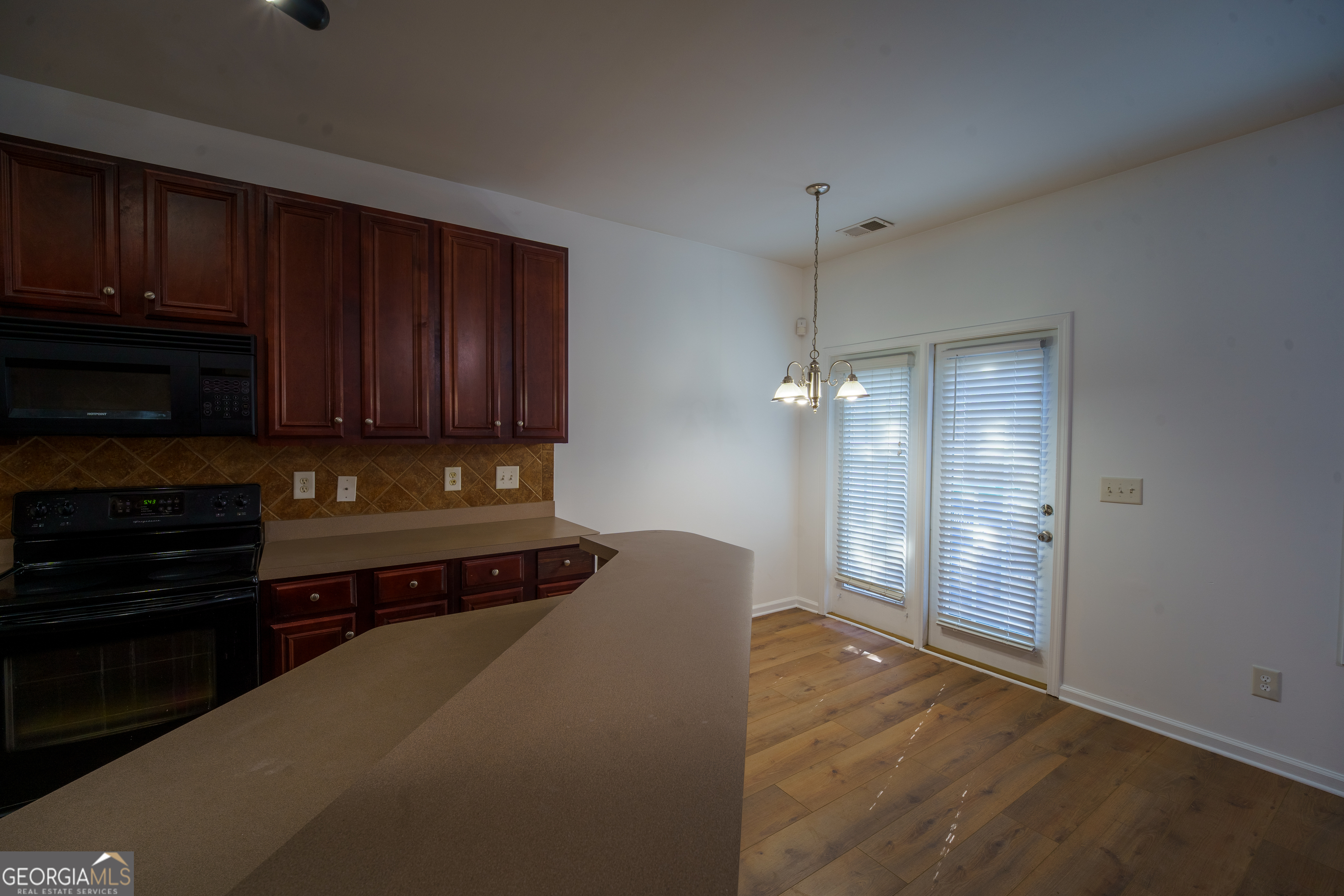2555 Flat Shoals Road, Unit 1402 South Fulton, GA 30349 - Photo 7 of 18 a view of a kitchen with electric appliances