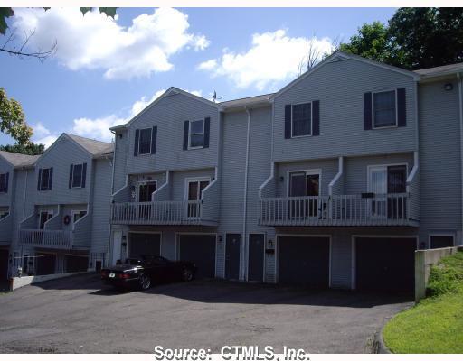 50 West Street, Unit 3 Waterbury, CT 06708 - Photo 1 of 1 a front view of a house with a yard