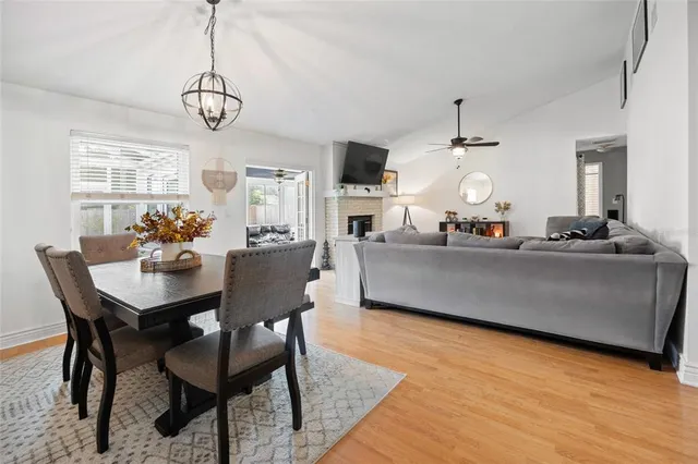 a view of a dining room with furniture wooden floor and chandelier