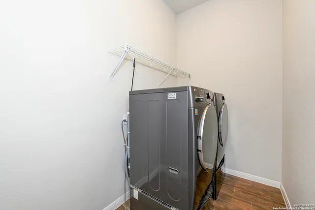a view of a storage & utility room with wooden floor