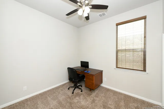 a workspace with furniture and a window