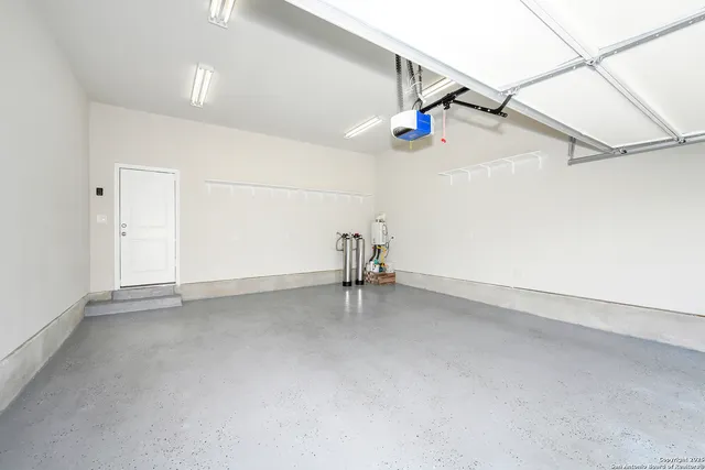 a view of a room with air conditioner and window