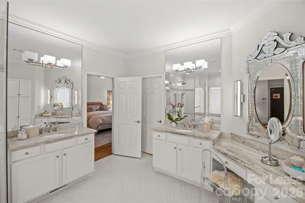 a spacious bathroom with a double vanity sink mirror and
