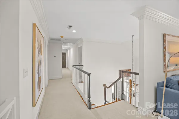 a view of a hallway with windows