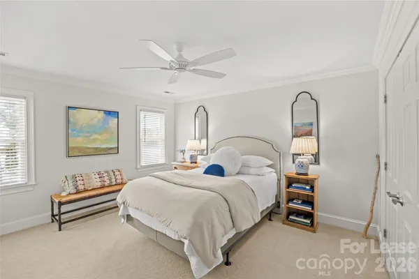 a bedroom with bed and a window