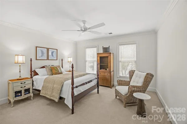 a bedroom with a bed chair and couch