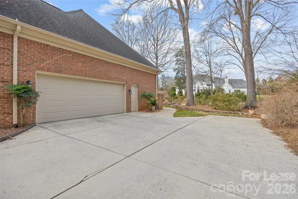 a view of garage with large tree