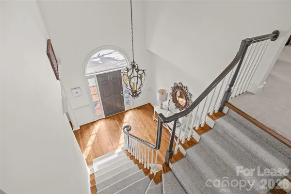 a view of an entryway with wooden floor