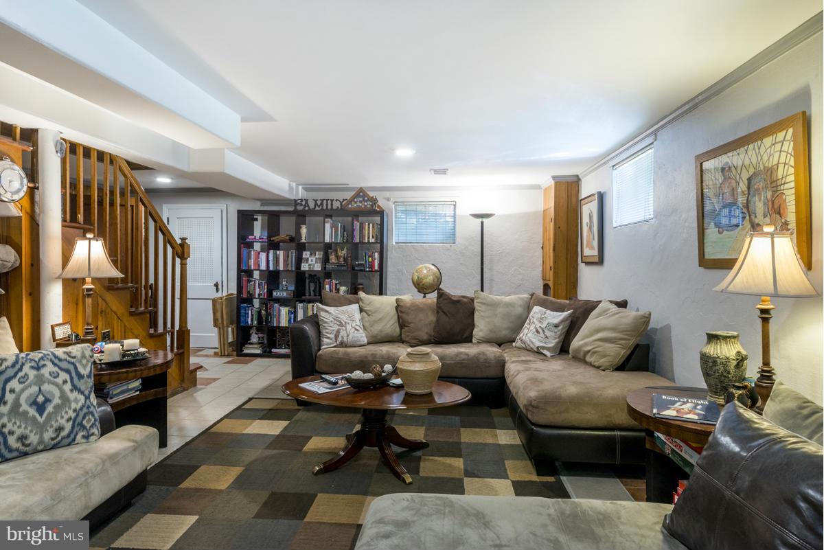 1312 Leegate Road Northwest Washington, DC 20012 - Photo 24 of 30 a living room with furniture and a potted plant
