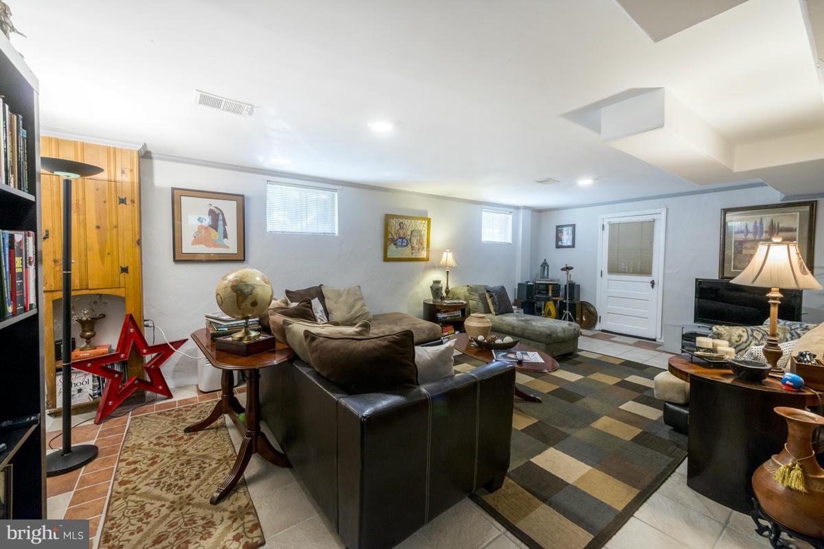 1312 Leegate Road Northwest Washington, DC 20012 - Photo 25 of 30 a living room with furniture kitchen view and a window