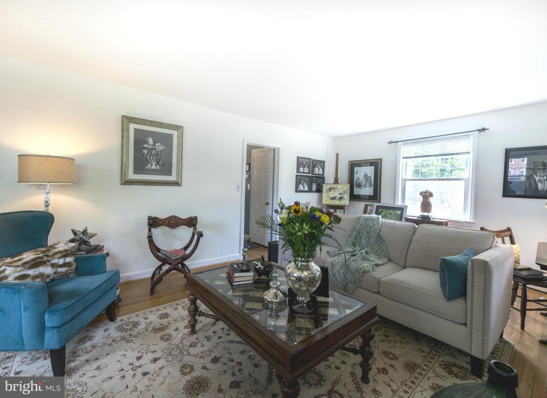 1312 Leegate Road Northwest Washington, DC 20012 - Photo 5 of 30 a living room with furniture and a potted plant