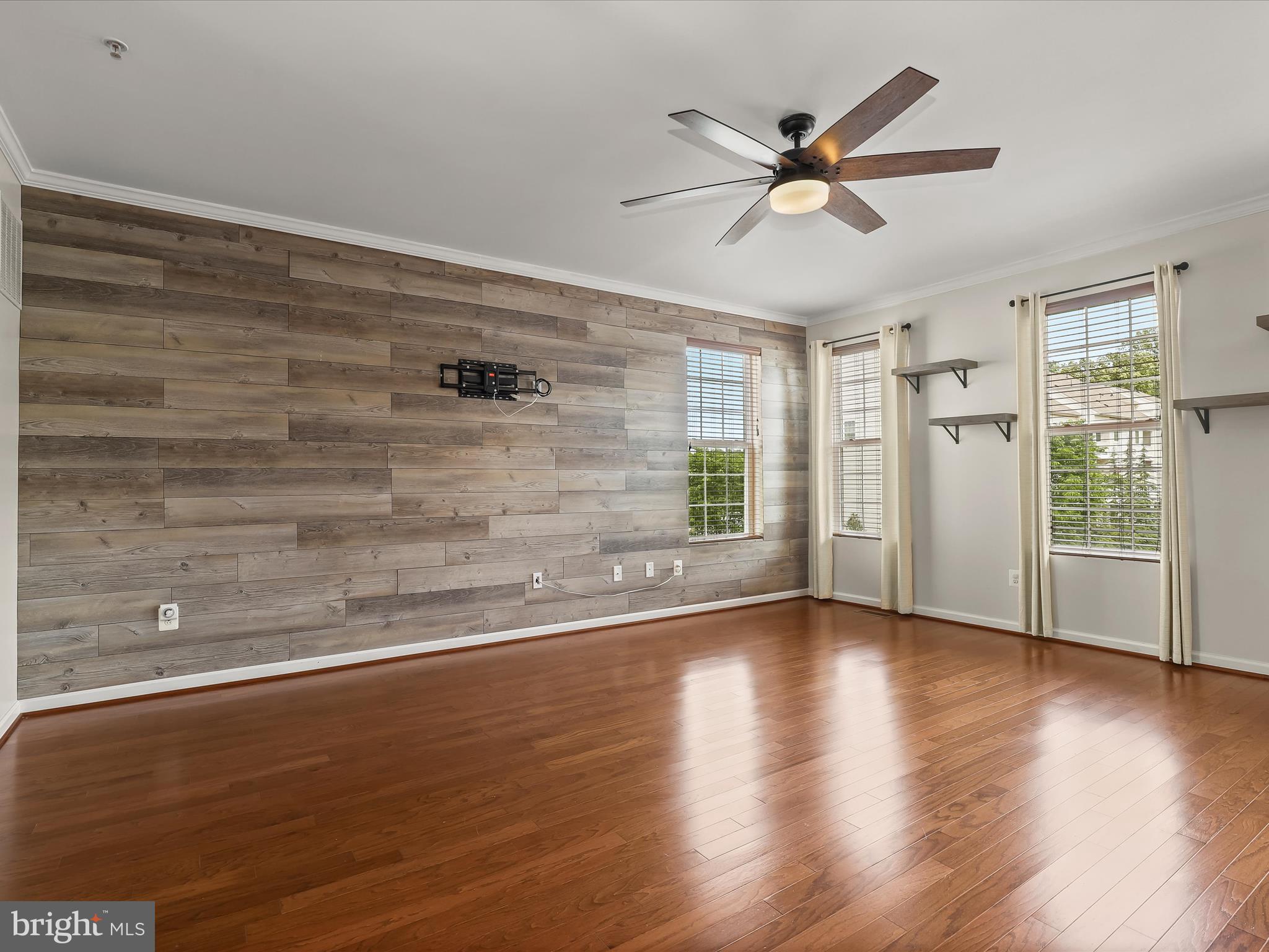 1024 Red Clover Road Gambrills, MD 21054 - Photo 8 of 57 a view of a livingroom with wooden floor and a ceiling fan