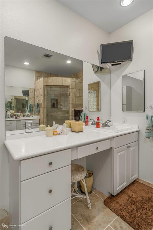 8260 Mira Myrtis Road Rodessa, LA 71069 - Photo 30 of 36 a bathroom with a double vanity sink mirror and