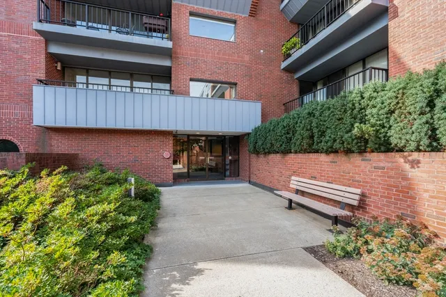 a view of a patio with table and chairs with wooden fence and plants