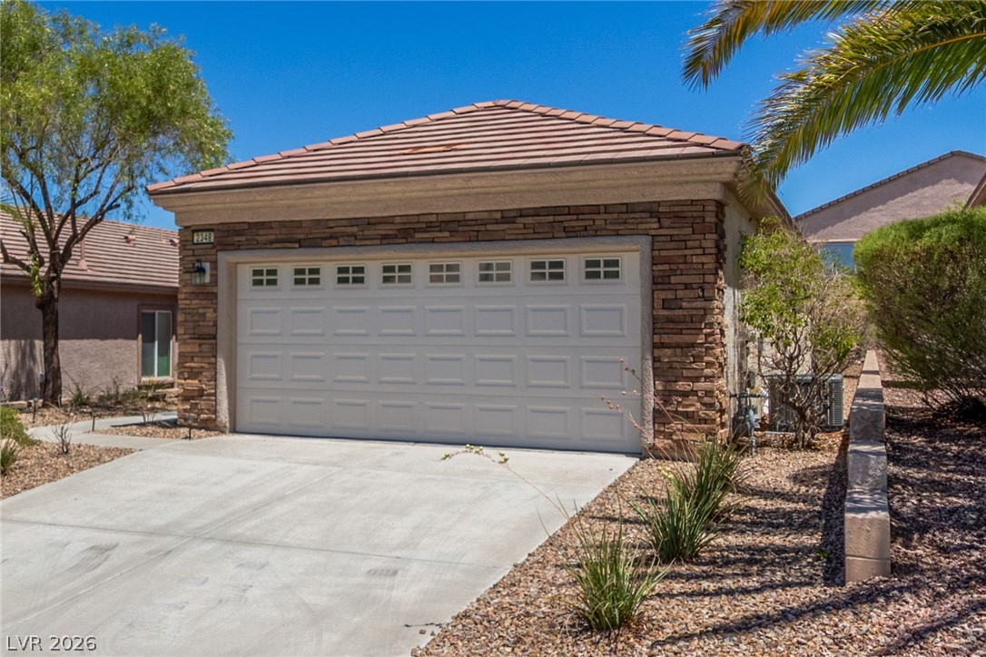 2348 Celestial Moon Street Henderson, NV 89044 - Photo 3 of 43 2 Car Garage w/ upgraded stone facia