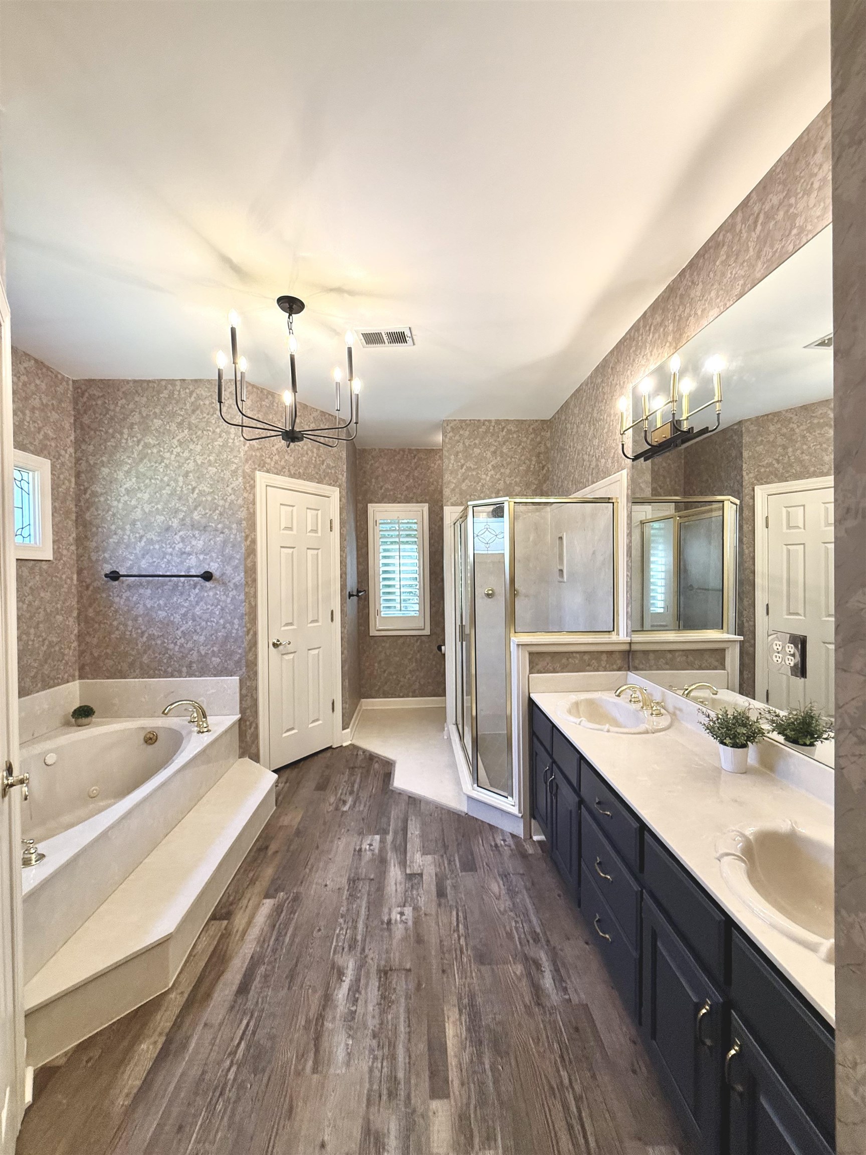 756 Crestover Drive Collierville, TN 38017 - Photo 17 of 38 a spacious bathroom with a granite countertop tub sink and mirror
