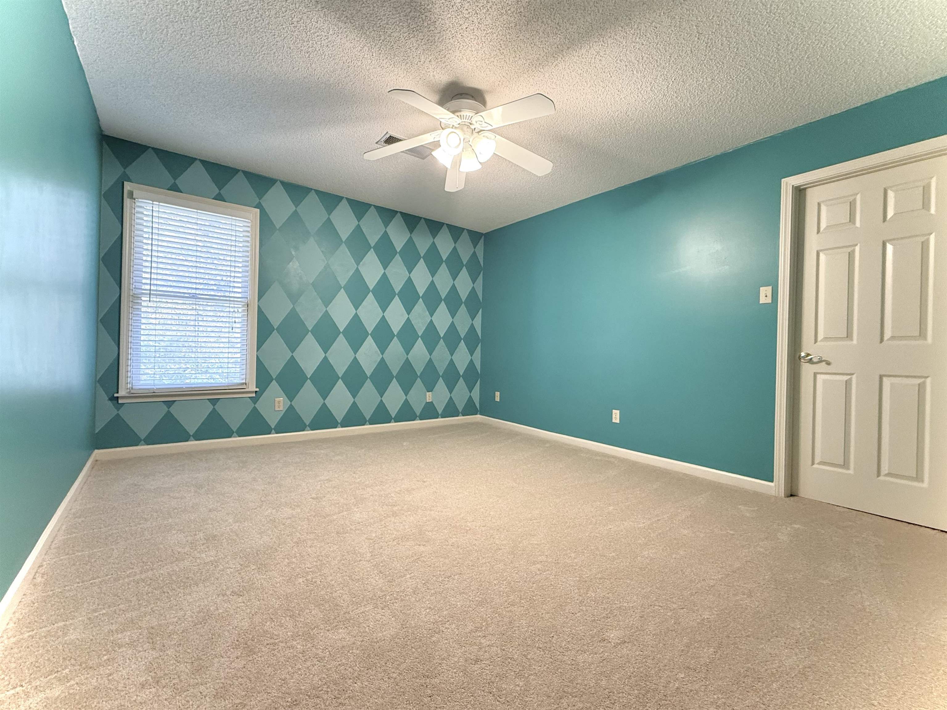 756 Crestover Drive Collierville, TN 38017 - Photo 22 of 38 an empty room with windows and ceiling fan