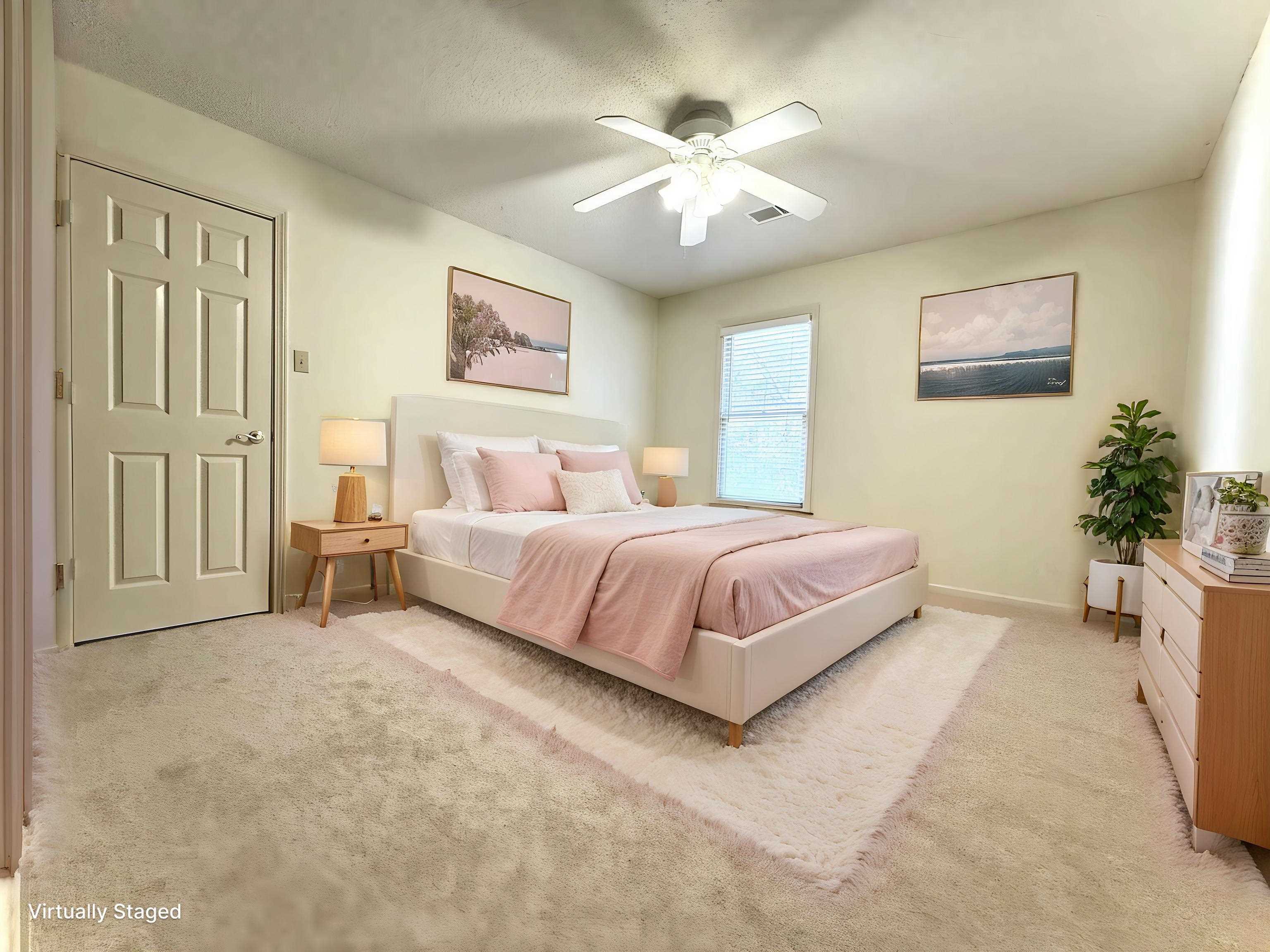 756 Crestover Drive Collierville, TN 38017 - Photo 23 of 38 a bedroom with a large bed and a chandelier