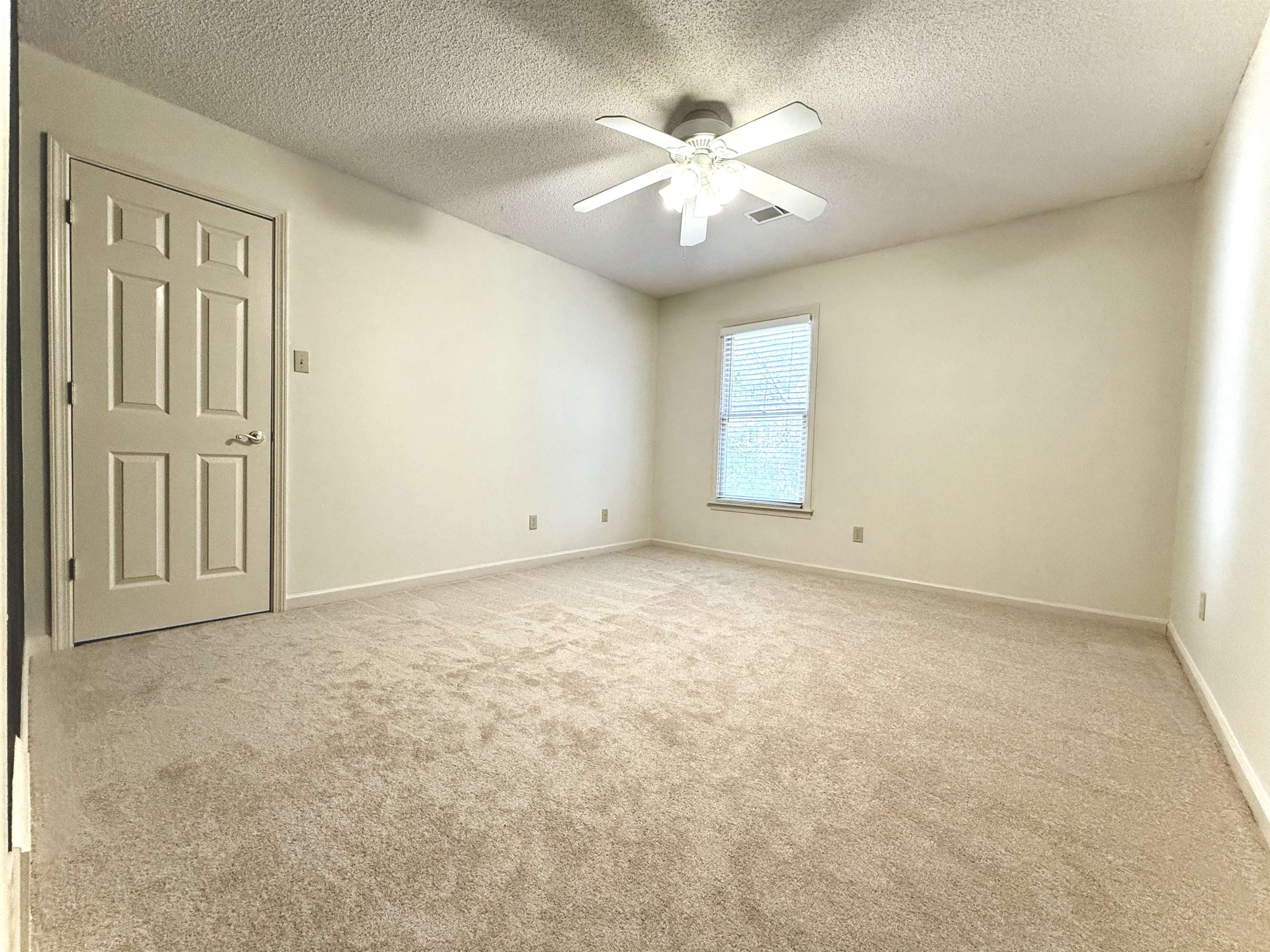 756 Crestover Drive Collierville, TN 38017 - Photo 24 of 38 an empty room with chandelier fan and windows