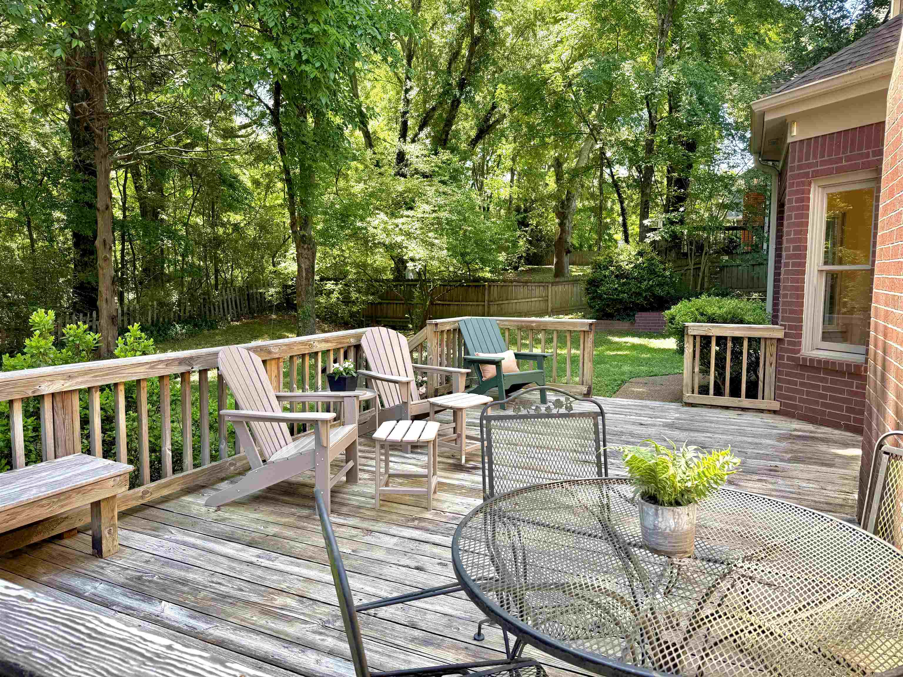 756 Crestover Drive Collierville, TN 38017 - Photo 33 of 38 a view of a patio with couches chairs potted plants and wooden floor