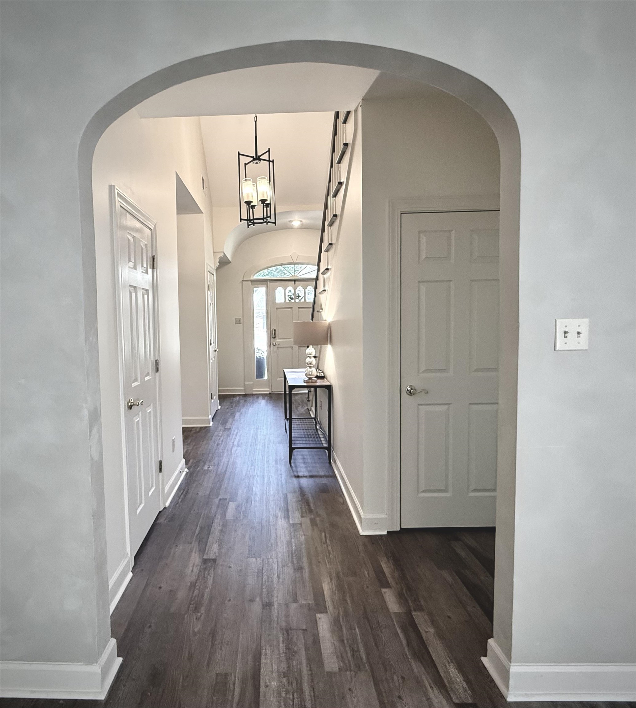 756 Crestover Drive Collierville, TN 38017 - Photo 6 of 38 a view of a hallway with wooden floor and a living room