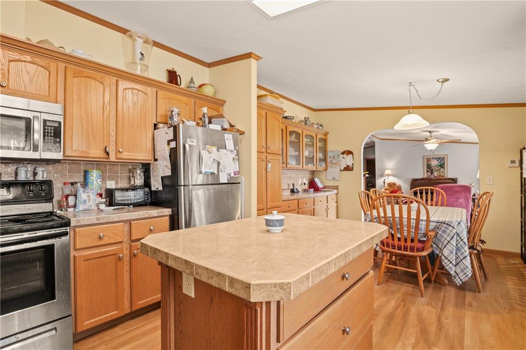 64 High View Drive Donegal, PA 15628 - Photo 7 of 9 a kitchen with a table chairs refrigerator and cabinets