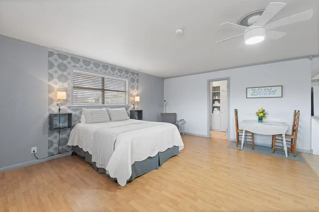 a bedroom with a bed and window