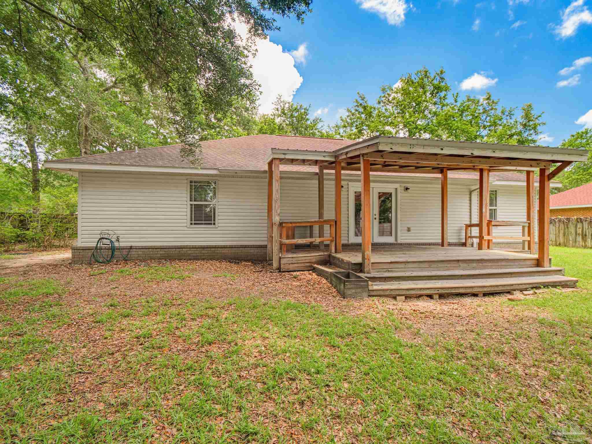 5567 Jones Street Milton, FL 32570 - Photo 47 of 48 a view of a house with backyard and sitting area