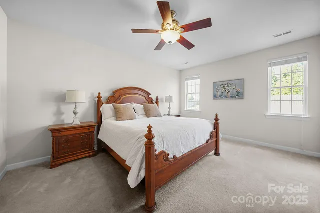 a bathroom with a tub a sink and mirror